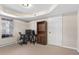 Finished basement with carpeting features a window and an office or study area at 7810 Rose Ct, Cumming, GA 30040