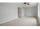 Spacious bedroom featuring neutral walls, plush carpeting, and double closets for ample storage at 7810 Rose Ct, Cumming, GA 30040