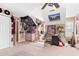 Spacious bedroom with eclectic decor, posters, and personal items create a unique, personalized living space at 7810 Rose Ct, Cumming, GA 30040