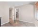 Functional room with tile flooring showing two open doorways leading to other rooms and neutral paint at 7810 Rose Ct, Cumming, GA 30040