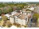 A birds eye view shows the apartment complex surrounded by a canopy of trees and the skyline off in the distance at 2230 Cheshire Bridge Ne Rd # 410, Atlanta, GA 30324