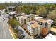 A vibrant aerial view showcases the apartment complex with its proximity to the cityscape and surrounding lush greenery at 2230 Cheshire Bridge Ne Rd # 410, Atlanta, GA 30324