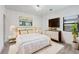Bright bedroom features a cozy white rug, large dresser, and modern decor at 2230 Cheshire Bridge Ne Rd # 410, Atlanta, GA 30324