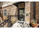 Stone exterior with unit number 400, a secure entry door, and wrought iron railing at 2230 Cheshire Bridge Ne Rd # 410, Atlanta, GA 30324