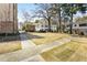 A walkway between buildings with sidewalks and landscaping at 2230 Cheshire Bridge Ne Rd # 410, Atlanta, GA 30324