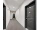 Well-lit hallway with neutral carpeting and doors, featuring unit numbers for easy navigation at 2230 Cheshire Bridge Ne Rd # 410, Atlanta, GA 30324