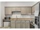 Kitchen with stainless steel appliances, grey cabinets, and granite counters at 2230 Cheshire Bridge Ne Rd # 410, Atlanta, GA 30324