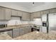 Kitchen featuring stainless steel appliances, granite counters and gray cabinetry at 2230 Cheshire Bridge Ne Rd # 410, Atlanta, GA 30324