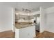 Kitchen featuring stainless steel appliances, gray cabinetry, and a breakfast bar at 2230 Cheshire Bridge Ne Rd # 410, Atlanta, GA 30324