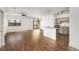Bright open-concept living room with wood floors, modern light fixtures, and access to a private balcony at 2230 Cheshire Bridge Ne Rd # 410, Atlanta, GA 30324
