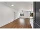 Open floor plan showcasing hardwood floors, granite countertops, and access to a balcony at 2230 Cheshire Bridge Ne Rd # 410, Atlanta, GA 30324