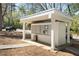 Outdoor mailboxes are protected from the elements by a structure with white pillars, a roof, and concrete paving stones at 2230 Cheshire Bridge Ne Rd # 410, Atlanta, GA 30324