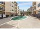 A community pool with lounge chairs and landscaping at 2230 Cheshire Bridge Ne Rd # 410, Atlanta, GA 30324