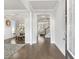 Spacious entryway with hardwood floors transitions into the dining room and living room, showcasing an open floor plan at 3906 Lockaby Way, Lawrenceville, GA 30044