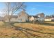 The home's backyard shows a well-maintained lawn and exterior features at 4410 Millenium View Ct, Snellville, GA 30039