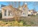 A shot of the house's backyard with green grass and a treed perimeter at 4410 Millenium View Ct, Snellville, GA 30039