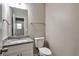 Powder room featuring a granite vanity top, white cabinet, and neutral wall color at 4410 Millenium View Ct, Snellville, GA 30039