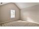 Bedroom with vaulted ceilings, neutral walls, carpet, and natural light at 4410 Millenium View Ct, Snellville, GA 30039