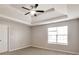This spacious bedroom features a trey ceiling with fan and a large window offering natural light at 4410 Millenium View Ct, Snellville, GA 30039