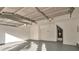 A two car garage with newly epoxied floor and water heater at 4410 Millenium View Ct, Snellville, GA 30039