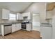Modern kitchen featuring granite countertops, stainless steel appliances, and vaulted ceiling at 4410 Millenium View Ct, Snellville, GA 30039