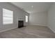 Open living room featuring a fireplace, large windows, and neutral paint colors at 471 Charleston Pl, Villa Rica, GA 30180