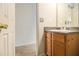 Functional bathroom featuring a granite-style vanity top, wood cabinets, and essential fixtures at 5080 Galleon Xing, Decatur, GA 30035