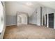 Large bonus room with vaulted ceilings, neutral paint and carpet offers customization and versatility at 5080 Galleon Xing, Decatur, GA 30035