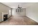 Bright living room with a fireplace, ceiling fan, and natural light at 5080 Galleon Xing, Decatur, GA 30035