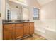 Bathroom featuring double vanity, large soaking tub, and window to let the sunshine in at 5080 Galleon Xing, Decatur, GA 30035