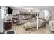Finished basement with brick fireplace, neutral tones, and versatile living and workspace areas at 5140 Cowart Ct, Powder Springs, GA 30127