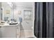 Bathroom featuring a vanity with a mirror, and a shower with a curtain at 5140 Cowart Ct, Powder Springs, GA 30127