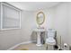Bathroom featuring a pedestal sink, toilet and natural light at 5140 Cowart Ct, Powder Springs, GA 30127