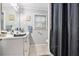 Clean bathroom featuring a vanity with a sink and a shower with a curtain at 5140 Cowart Ct, Powder Springs, GA 30127