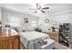 Charming bedroom with ceiling fan, soft lighting, and ample space for relaxation and storage at 5140 Cowart Ct, Powder Springs, GA 30127