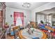 Bright dining room featuring hardwood floors and is connected to the living room for easy entertaining and Gathering meals at 5140 Cowart Ct, Powder Springs, GA 30127