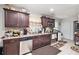 Efficient kitchen with stainless steel appliances, ample counter space, and dark wood cabinetry at 5140 Cowart Ct, Powder Springs, GA 30127