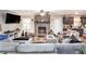 Comfortable living area featuring a brick fireplace and seamless flow into the kitchen at 5140 Cowart Ct, Powder Springs, GA 30127