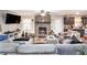 Comfortable living room features a brick fireplace and access to the kitchen area, perfect for entertaining at 5140 Cowart Ct, Powder Springs, GA 30127