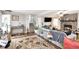 Open living room features a fireplace, hardwood floors, and a staircase to the upper level at 5140 Cowart Ct, Powder Springs, GA 30127