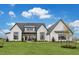 New construction home showcasing a modern farmhouse design with a well-manicured lawn at 1276 B Rutledge Rd, Acworth, GA 30101