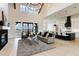 Spacious living room with fireplace and kitchen, highlighted by a modern chandelier and lots of natural light at 1276 B Rutledge Rd, Acworth, GA 30101