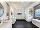 Main bathroom with a double vanity, a freestanding tub, and glass-enclosed shower at 1276 B Rutledge Rd, Acworth, GA 30101