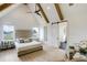 Serene main bedroom featuring a vaulted ceiling, exposed beams, and large windows at 1276 B Rutledge Rd, Acworth, GA 30101