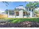 Spacious backyard showcasing the home's covered porch and modern design at 1653 Pamela Ne Dr, Brookhaven, GA 30319