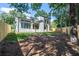 Large backyard with new sod, tall trees and a white brick home at 1653 Pamela Ne Dr, Brookhaven, GA 30319