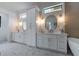 Elegant bathroom with double vanities, gold hardware, and modern finishes at 1653 Pamela Ne Dr, Brookhaven, GA 30319