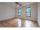 Bright bedroom featuring hardwood floors and large windows at 1653 Pamela Ne Dr, Brookhaven, GA 30319