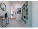 Inviting entryway with stylish tile flooring, built-in shelving and decor at 1653 Pamela Ne Dr, Brookhaven, GA 30319