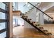 Bright entryway featuring modern stairs with glass railings and floor to ceiling windows at 1653 Pamela Ne Dr, Brookhaven, GA 30319